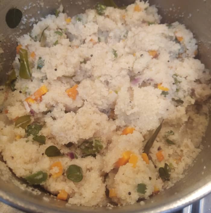 By that time rava absorbs all water and thickens. Once the water is absorbed cook covered on low flame for for 3-4 minutes to get soft upma. Keep stirring in between.