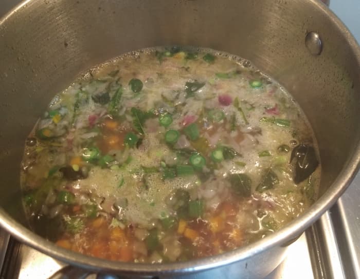 Close the lid and in medium flame boil water. Lower the flame and cook till vegetables turns soft. ( If you like to have upma with crunchy vegetables, don't cook them much).