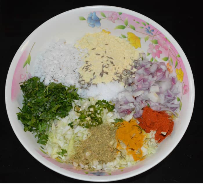 Step one: In a large mixing bowl, add all the ingredients as per instructions. While adding water little by little, prepare a lump-free but thick batter.