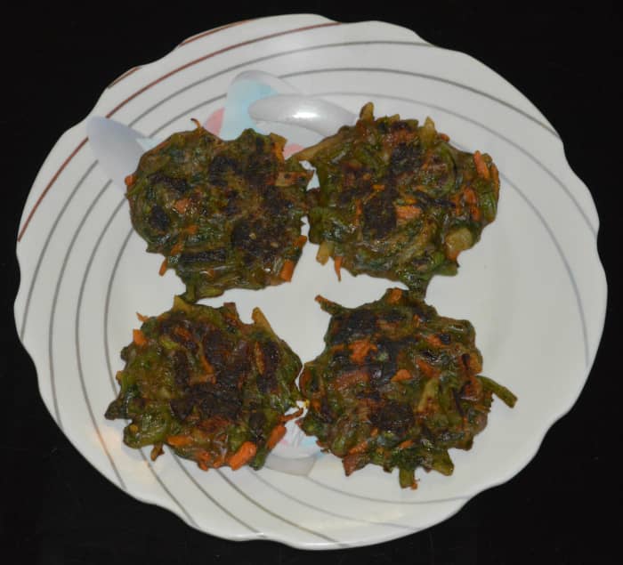 Remove them and place them on a serving plate. These pancakes don't need a side dish. They are very tasty on their own. They are soft, spicy, and flavorful. Tomato sauce pairs well with these pancakes. Enjoy!