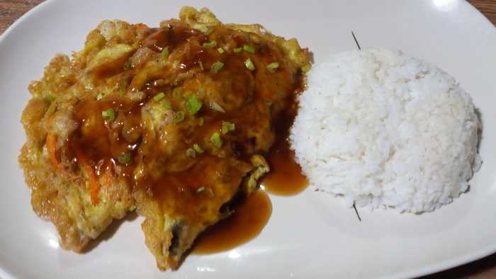 Serve egg foo young with steamed rice