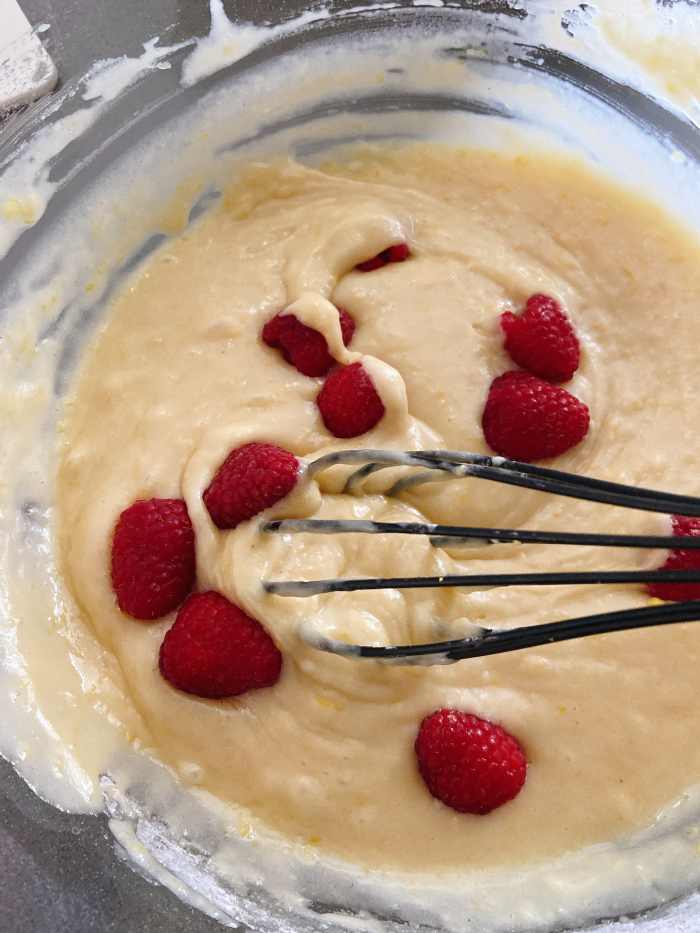 Slowly mix the raspberries to combine.