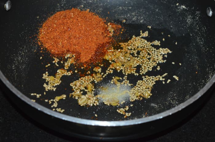 Add spice powder and some salt to the mixture. Mix well. This makes the stuffing for the spicy parathas.