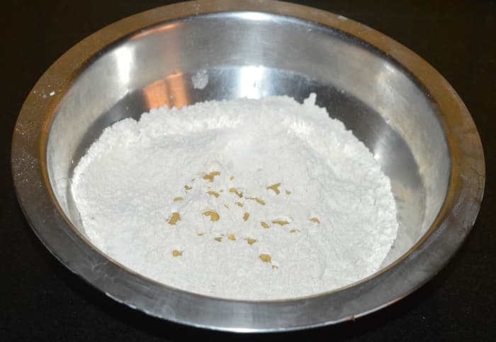 Step one: Make a smooth, firm, and pliable dough with wheat flour, oil, salt, and water as per instructions. Cover and rest it for 20 minutes.