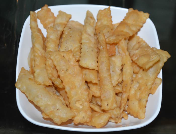 Similarly, make cheese crackers from the remaining dough portions. Once they cool down, store them in an airtight container. Enjoy eating them with hot tea or coffee or as a starter!