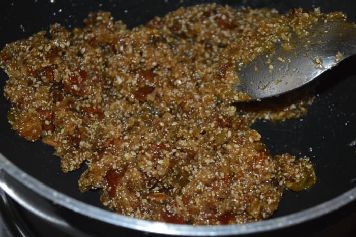 Saute the mixture over medium-low heat while stirring continuously until the whole mixture comes together to form a lump, leaving the bottom of the pan. Turn off the heat and transfer the mixture to a plate.
