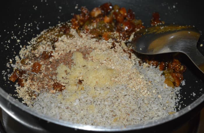 Step four: Add all the ingredients that you have set aside. Add 1 teaspoon of ghee and crushed almond-nutmeg powder.