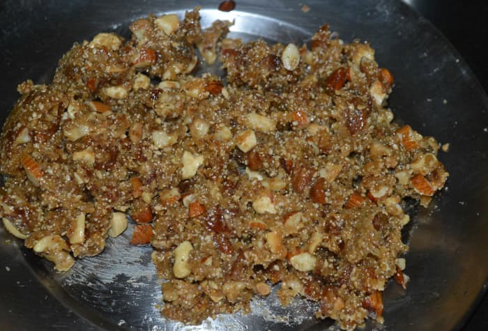 Step five: When the mixture has cooled enough to handle, form small lemon-sized balls. Set them aside cool completely.