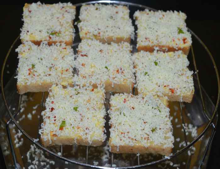 Step four: Once again, grate the cheese on the top. Sprinkle a very small amount of salt on top. Keep in mind that cheese contains some salt, so don't add too much salt.
