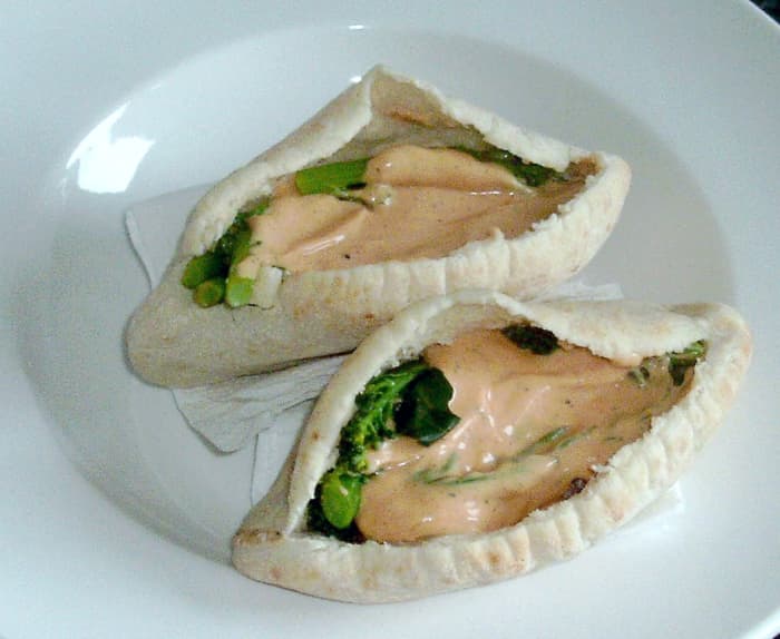 Corned beef and broccoli filled pitta breads with spicy sauce