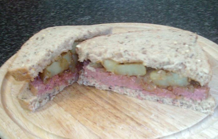 Corned beef with chilli and turmeric spiced potatoes and onions sandwich