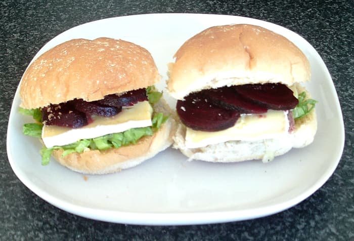 Sliced corned beef, beetroot and brie are combined with simple salad on toasted bread rolls