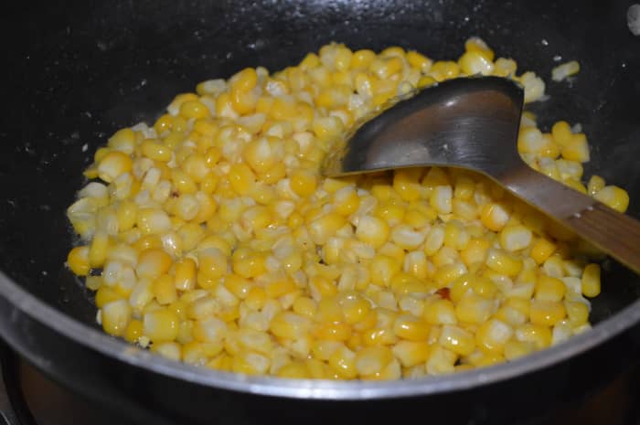In the same pan, saute the sweet corn kernels for 2-3 minutes. Transfer the mixure to the same plate as the paneer.