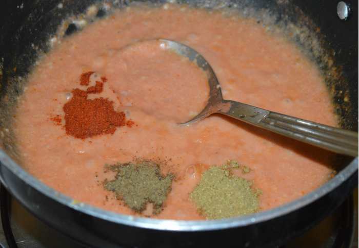 Add red chili powder, coriander powder, and garam masala powder. Mix well. Cook the mixture on medium heat for 4-5 minutes or until the tomato cooks well. Add water if needed to reduce the thickness of the gravy.