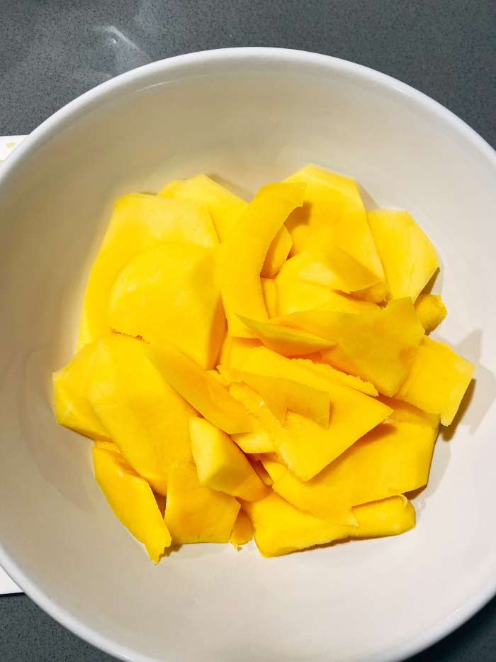 Peel and slice the mangoes. 