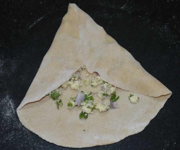 Fold the upper half portion along with the stuffing.