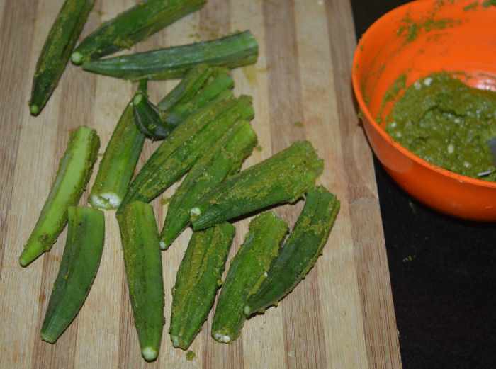 Stuff the paste inside all of the okra. If some paste remains, set aside.