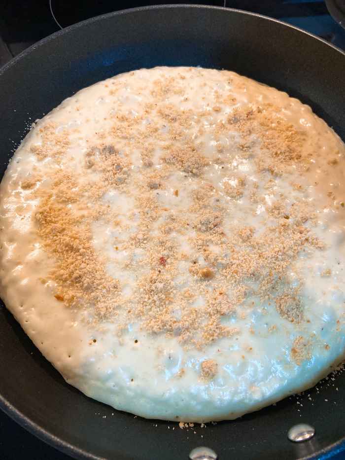 First, sprinkle the peanuts.