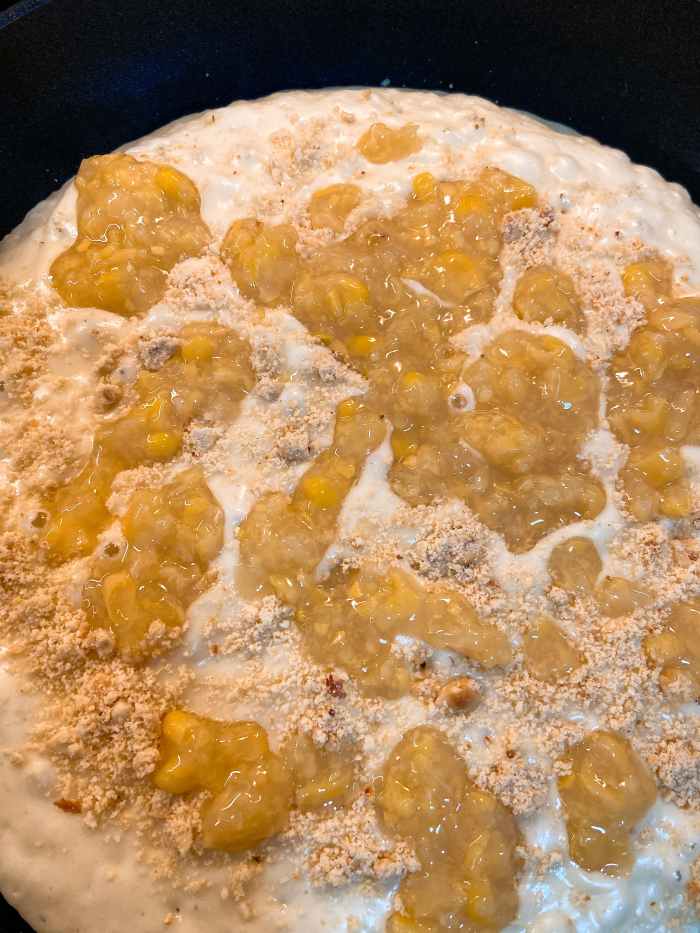 Use a spoon to scatter the creamy corn on the pancake. 