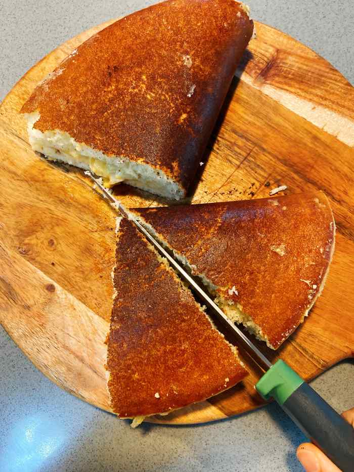 Transfer the pancake to the cutting board, let it sit for a few minutes before cutting. 