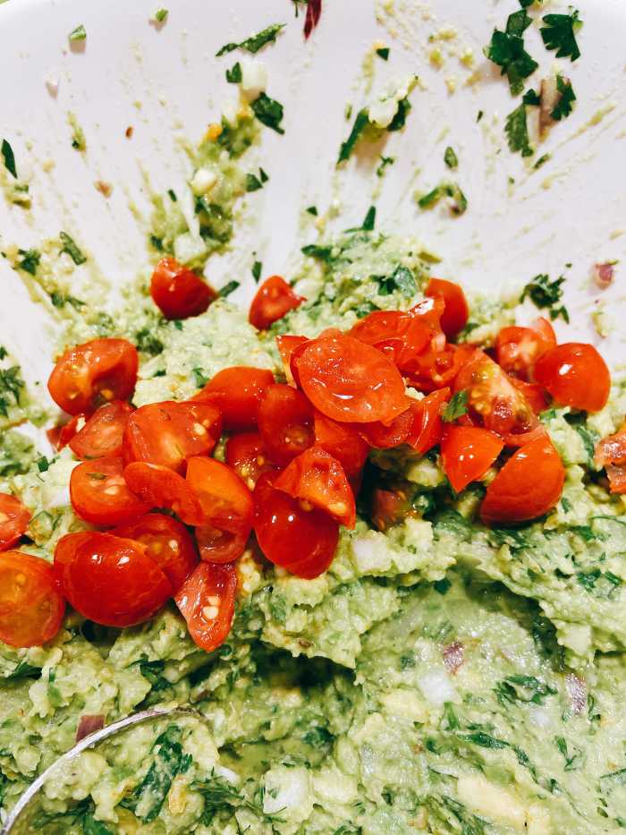 Combine the diced tomatoes to the mixture.