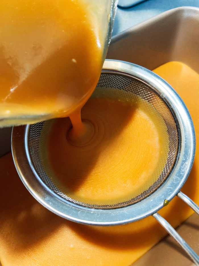 Pour the cake mixture into the prepared loaf pan.