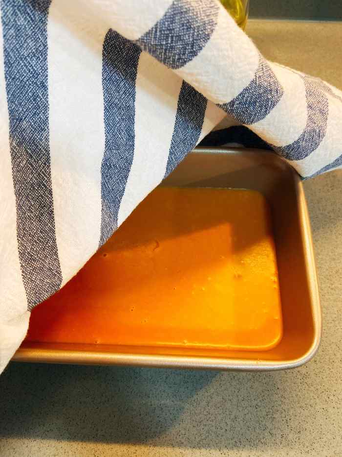 Cover with a cloth and let the cake mixture rest for an hour or more.