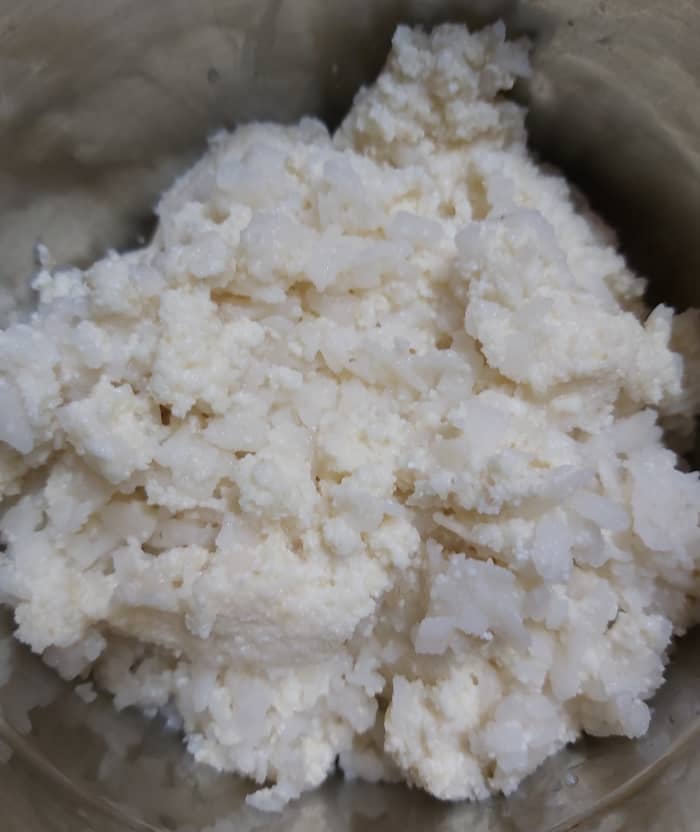 Transfer these soaked mixture to a mixer jar (do not drain extra water if any. It can be used for grinding).