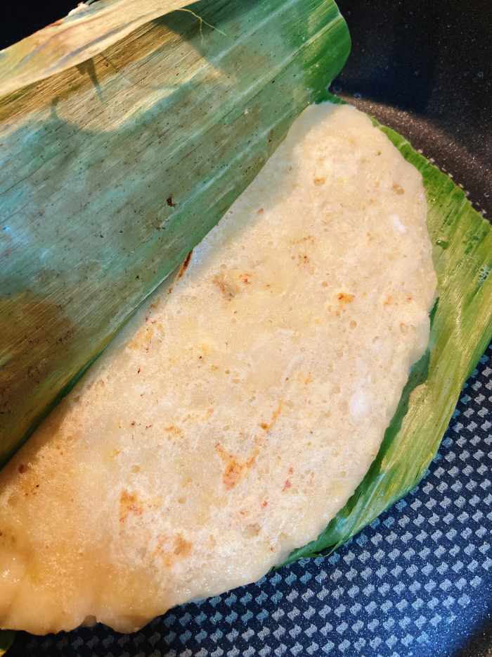 The banana pancake or lepek pisang is cooked. 