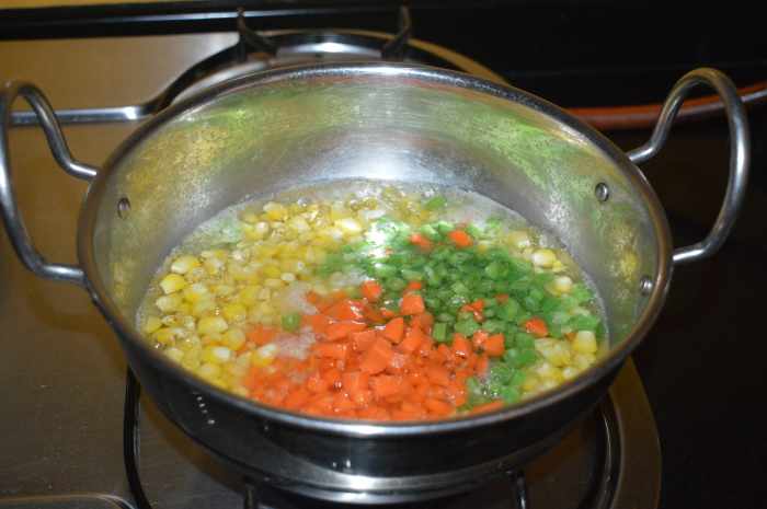 Add chopped French beans, carrots, and some salt.