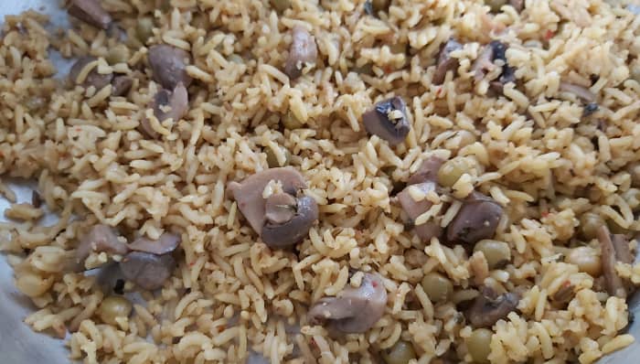 Once the pressure releases, open the cooker, sprinkle 4-5 drops of lemon juice. Mix well without breaking the rice grains.