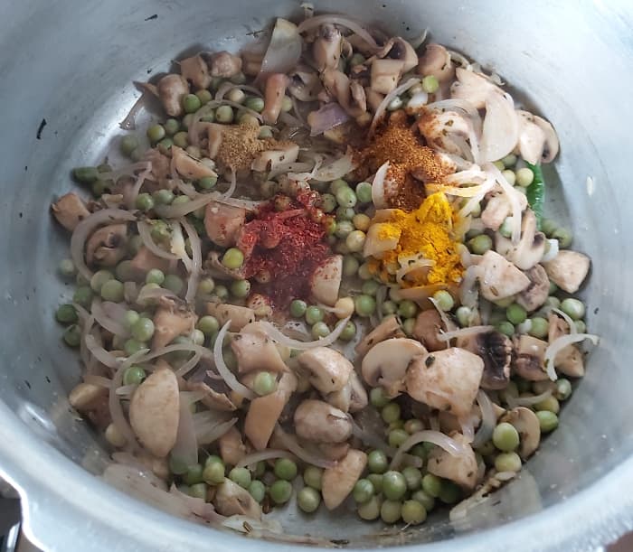 Add 1/2 teaspoon of turmeric powder, 1-2 teaspoons of red chili powder, 1-2 teaspoons of coriander powder and 1/2 teaspoon of garam masala powder.