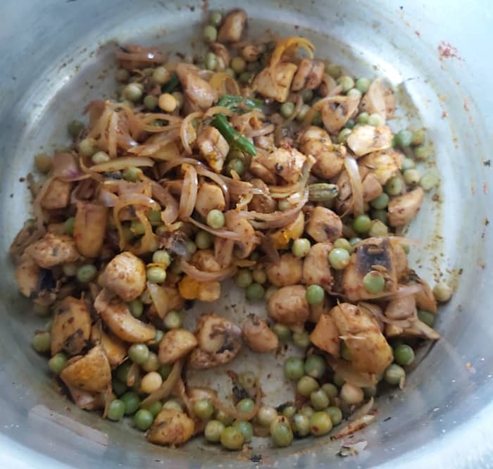 Mix and fry till vegetables coated well with spice powders and raw smell of spice powders goes away.