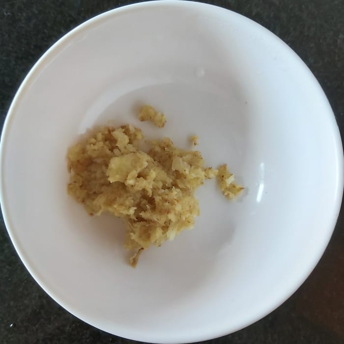 Grind a 1-2 inch long piece of fresh ginger and 5-6 cloves of garlic to make ginger-garlic paste. Set aside (or use store-bought ginger-garlic paste).
