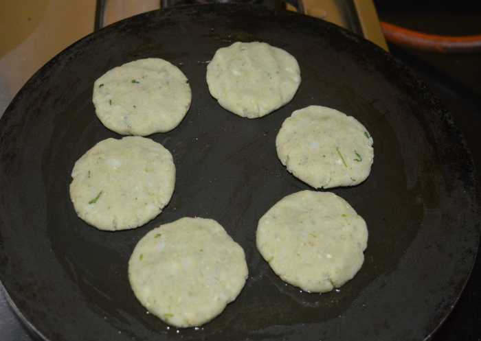 Heat a griddle or pan and grease it with some oil. Place the patties on it one near the other.