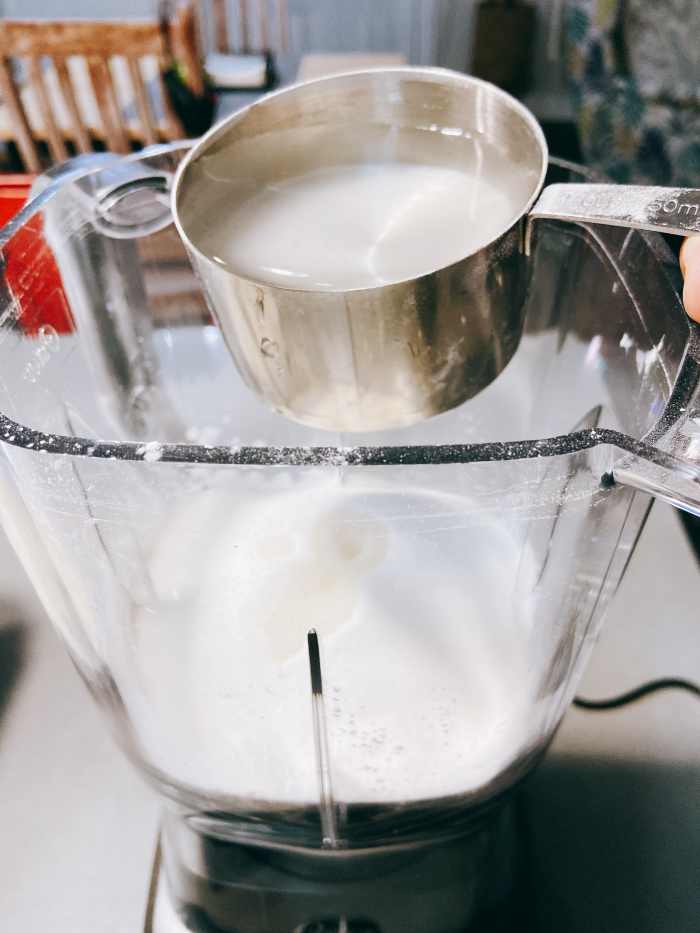 In a blender, combine the all-purpose flour, tapioca flour, water, and sugar. 