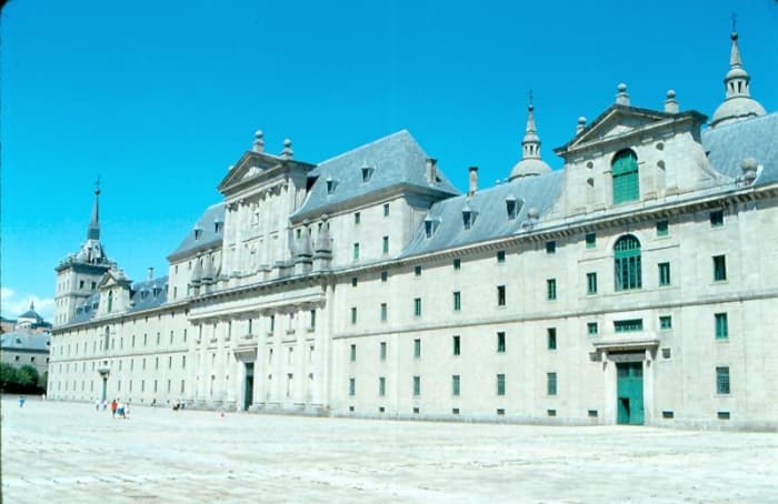 The facade of the El Escorial Monastery hint at the immensity of this religious and royal complex outside of Madrid. Built largely by Philip II of Spain, a devout Catholic, it was funded by Spain's New World gold.