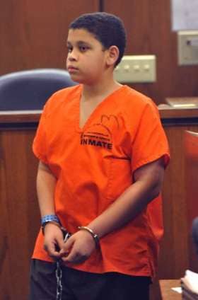 Now 13-year-old Christian at a pre-trial hearing earlier this year. He is being charged with first-degree-murder as an adult in the death of his younger brother.