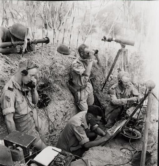 Canadian Forward observation team in Italy, 1943. Here your see a 5-man team. The only officer is holding the field glasses.