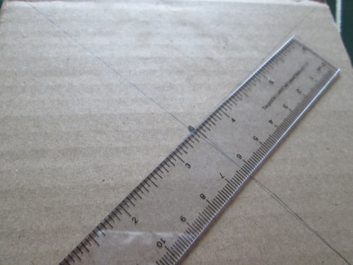 2. Drawing diagonals from one corner to the other on each side is needed to find the point where the two lines intersect, or otherwise, the centre of the square.