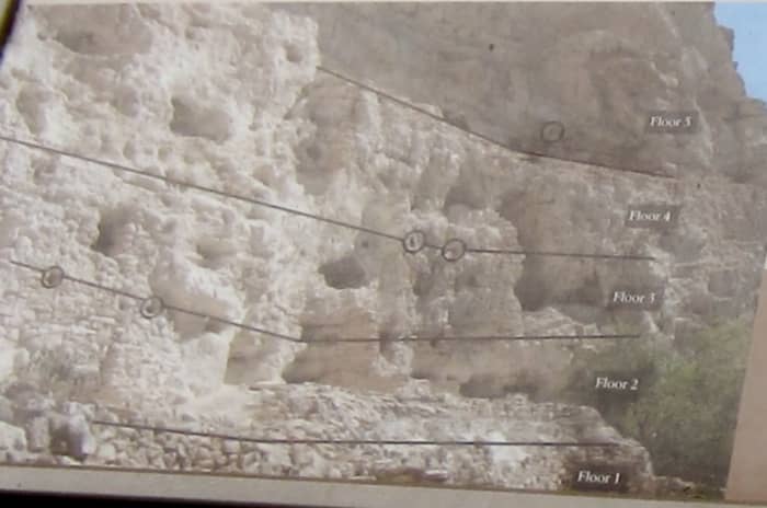 Parallel lines of socket holes for roof beams along cliff wall just west of Castle show location where Castle A once stood.