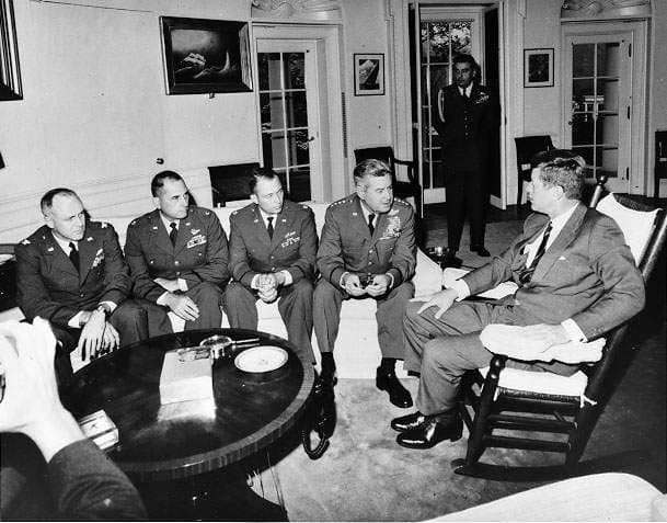 President Kennedy meets with General Curtis LeMay and reconnaissance pilots in the Oval Office. This is not the meeting described in the text, but a later meeting during the Cuban Missile Crisis (October 1962).