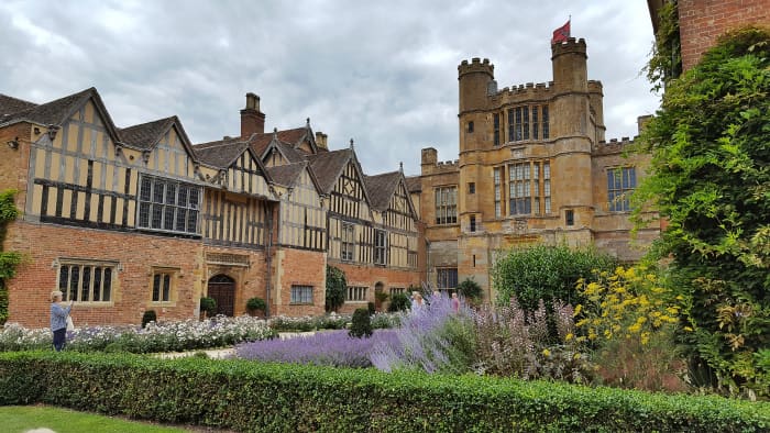 The Tudor gatehouse stands at a central focal point, around which the rest of Coughton Court has been built.