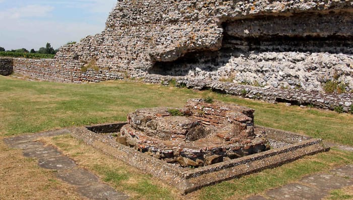 In the back ground of this photo is part of the Roman wall, but in the foreground is a baptismal font, a rare example of Christian Roman belief, and the last known Roman building on the site dating to the 4th century AD