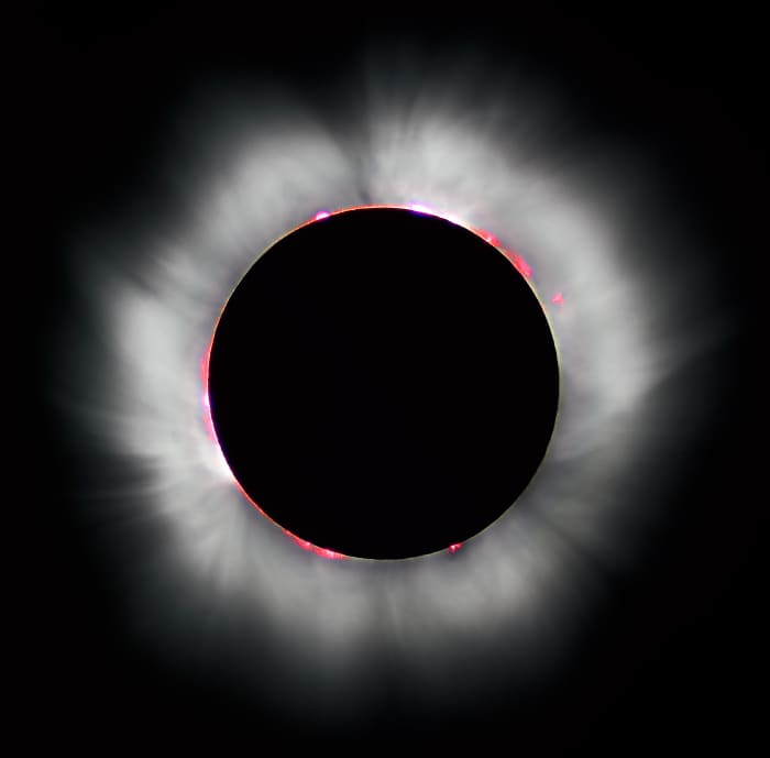 A total eclipse is surrounded by a corona of light, A corona is defined as the rarefied gaseous envelope of the sun.