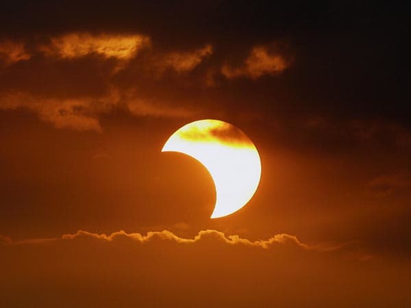 A partial solar eclipse or a total solar eclipse in progress often gives the impression that something is taking a big bite out of the sun.