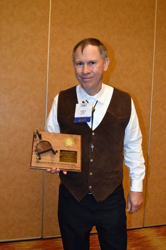 Patrick Dearen displays Spur Award for best Western novel of year on July 2015.