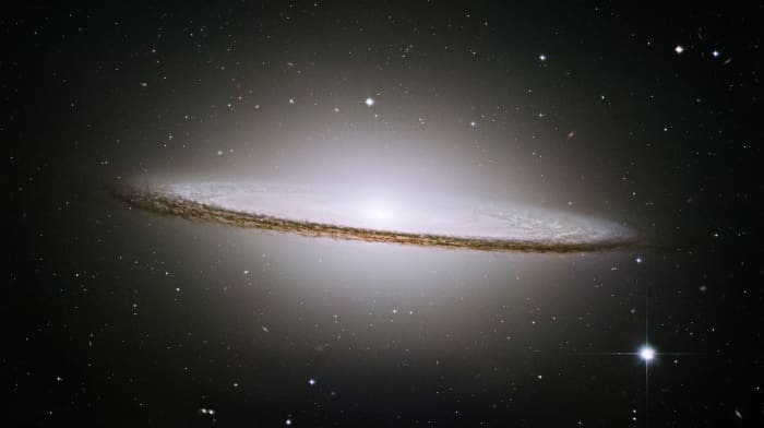 A photo of the Sombrero galaxy (M104). This galaxy is a bright, energetic elliptical galaxy.