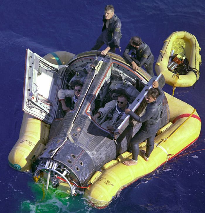 Gemini 8 capsule following splashdown in the western Pacific ocean, approximately 800km east of Okinawa, the result of an emergency landing. Aboard the capsule are United States astronauts David Scott (left) and Neil Armstrong (right).