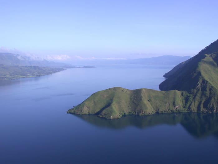 Lake Toba on the island of Sumatra in Indonesia sits on top of the site for the Toba Supervolcano